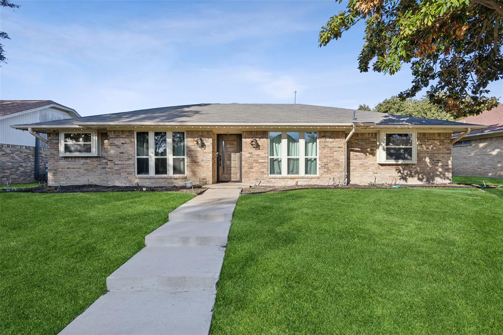 front view of a house with a yard