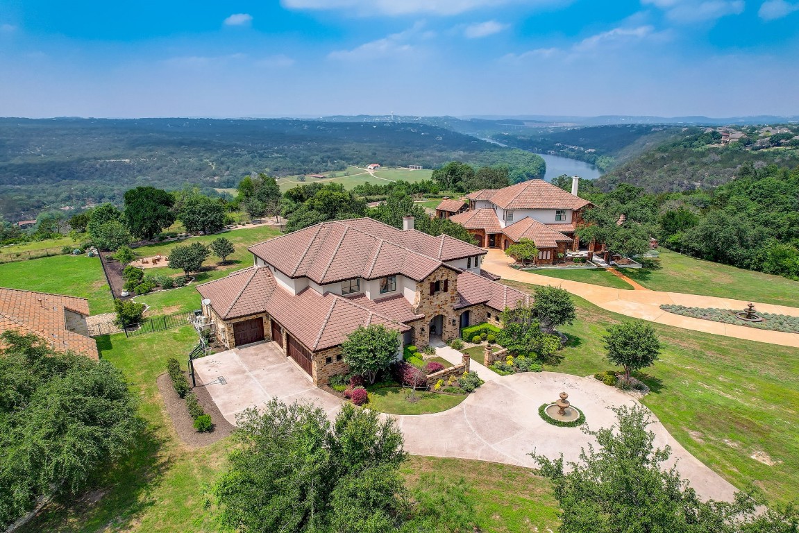 224 Dawn River Cove is a custom estate nestled in the prestigious gated community of Sierra Vista in Steiner Ranch. This expansive 5,711 sq ft residence sits on a sprawling 1.2-acre lot, offering unparalleled privacy and luxury.