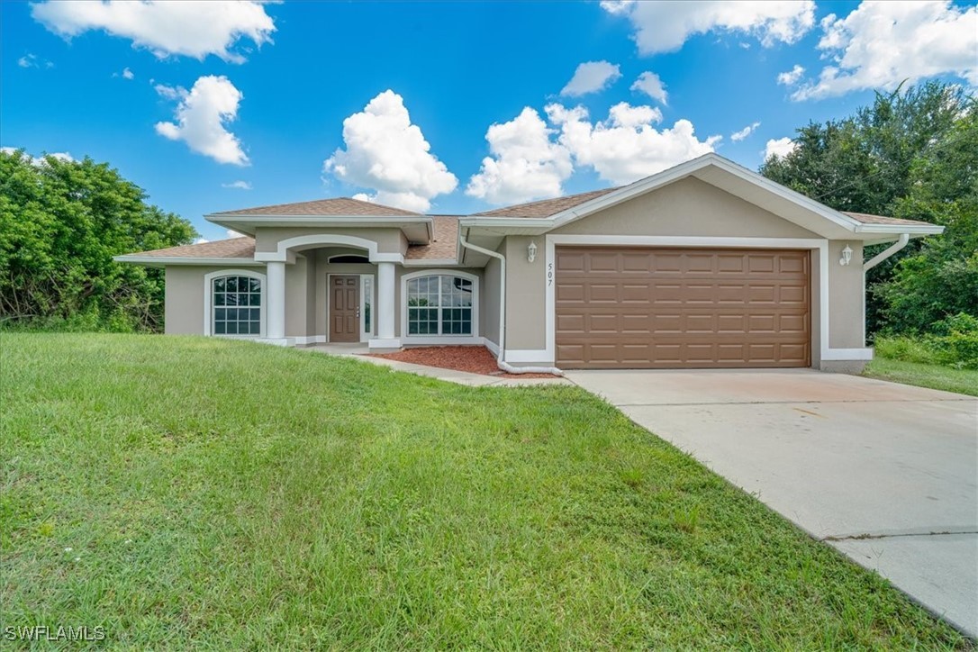 a front view of a house with yard