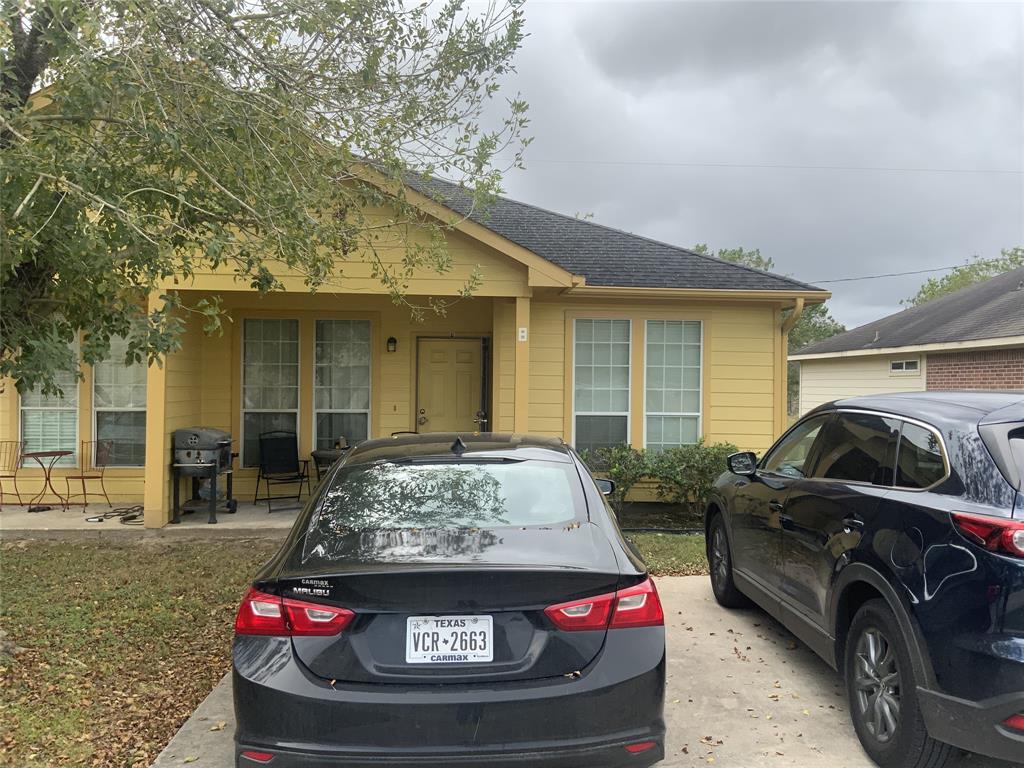 a view of car parked in front of a house