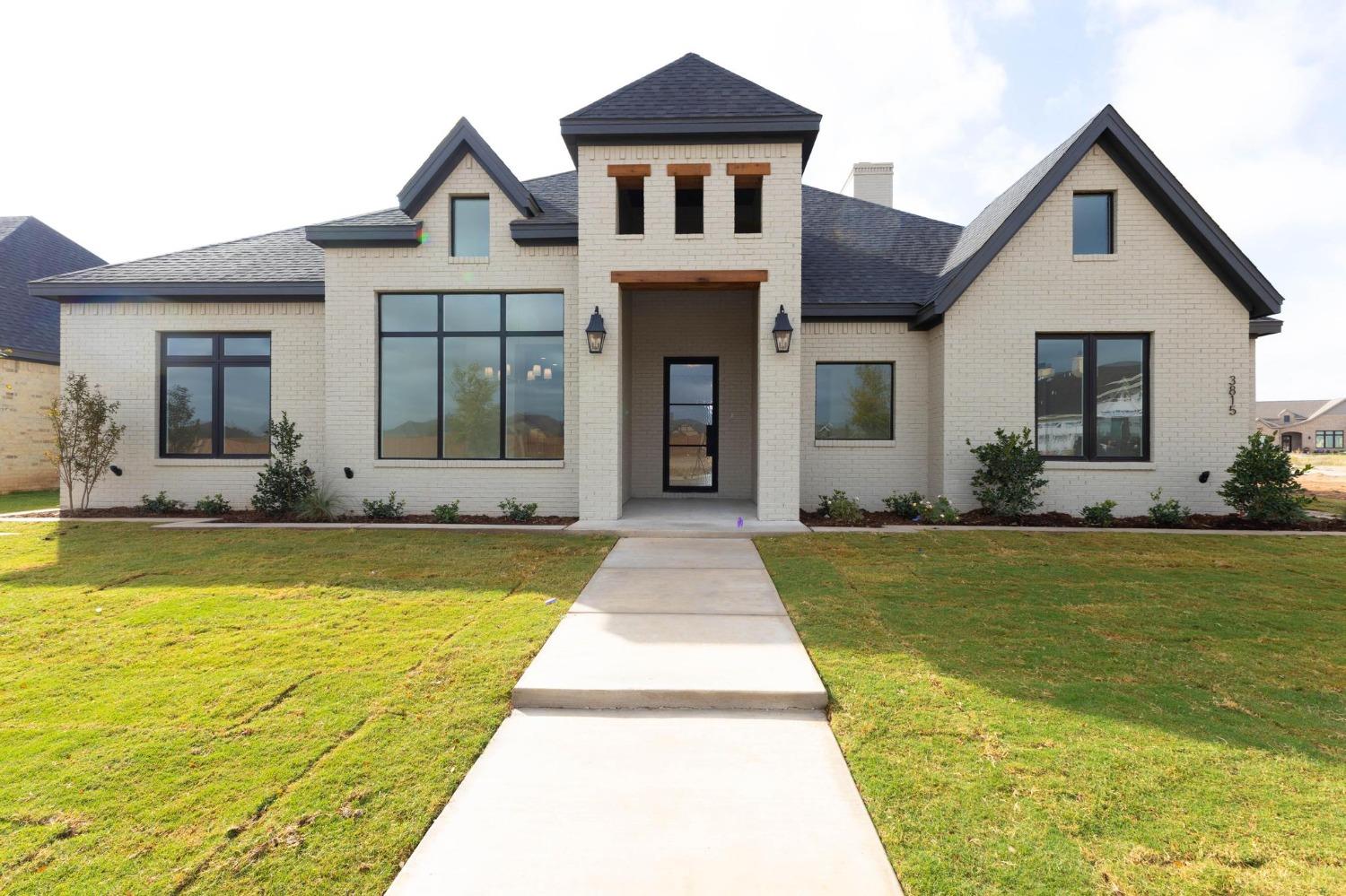 a front view of a house with swimming pool