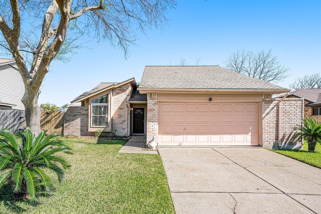 a house with yard in front of it