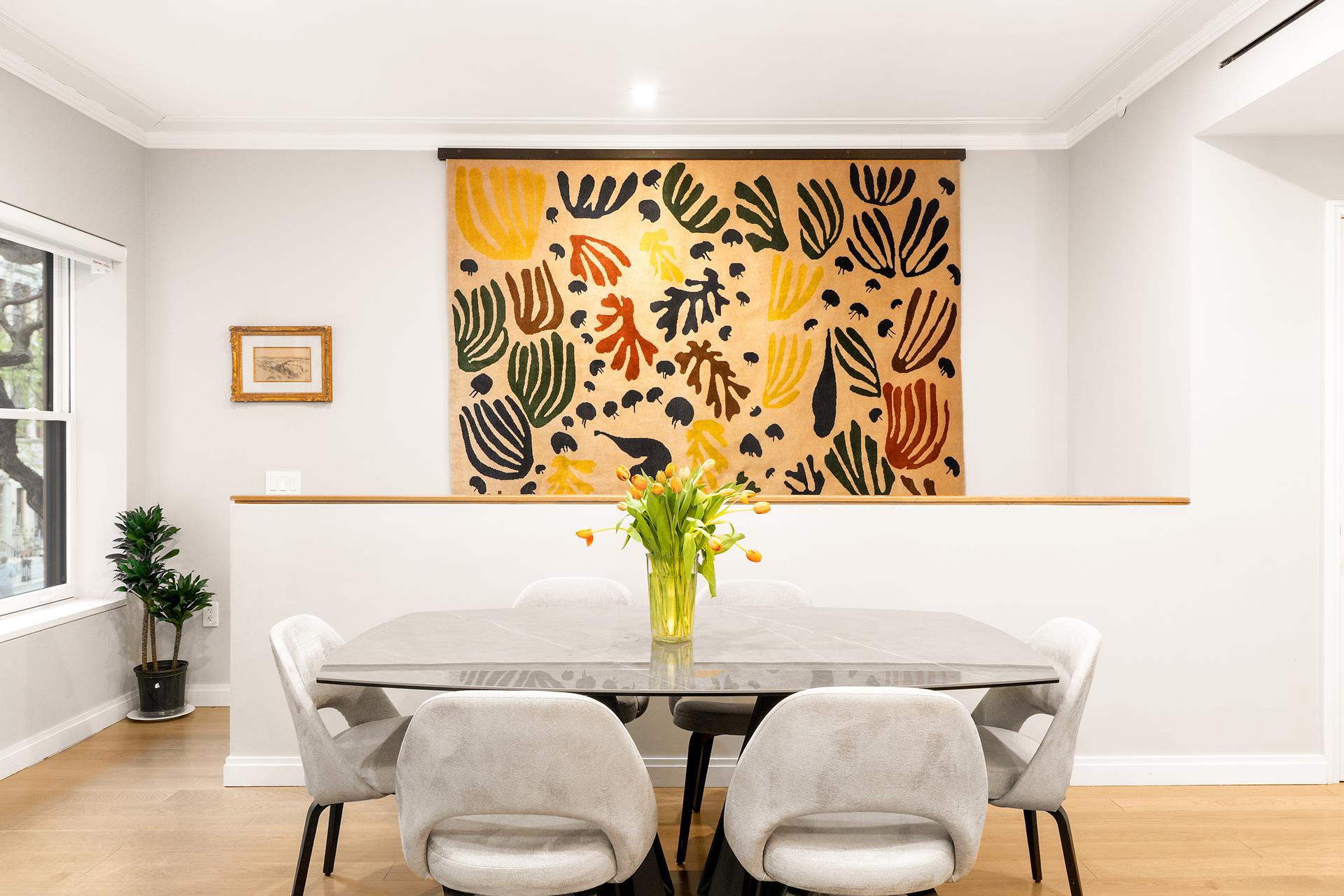 a view of a dining room with furniture and wooden floor