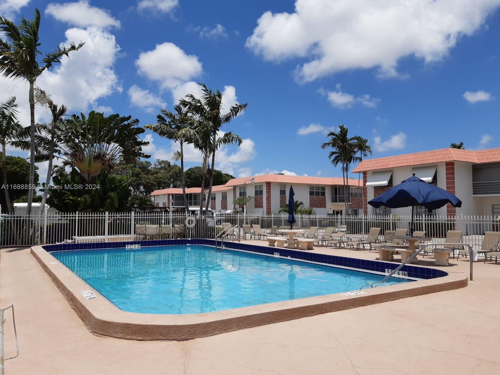 a view of a swimming pool with a patio