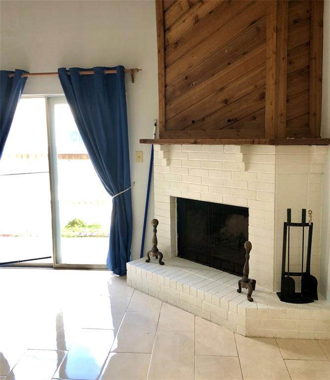 Discover contemporary living with this tastefully updated home featuring sleek modern tiles, a rustic cedar mantle, and elegant new blackout curtains—all creating a sophisticated and inviting atmosphere.