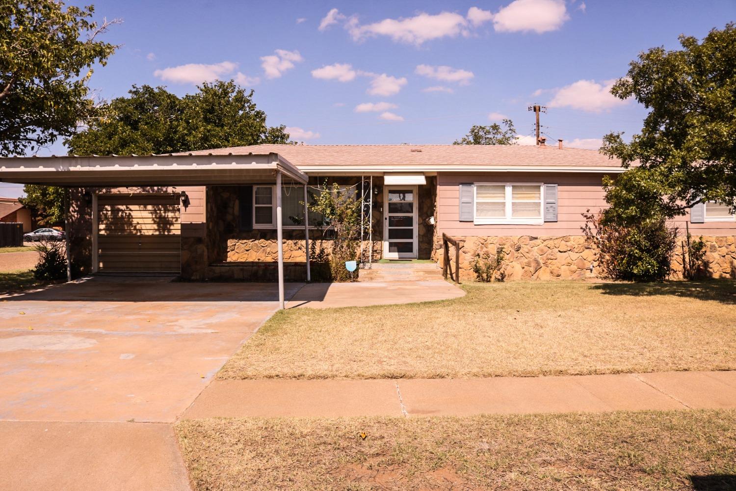 a front view of a house with a patio