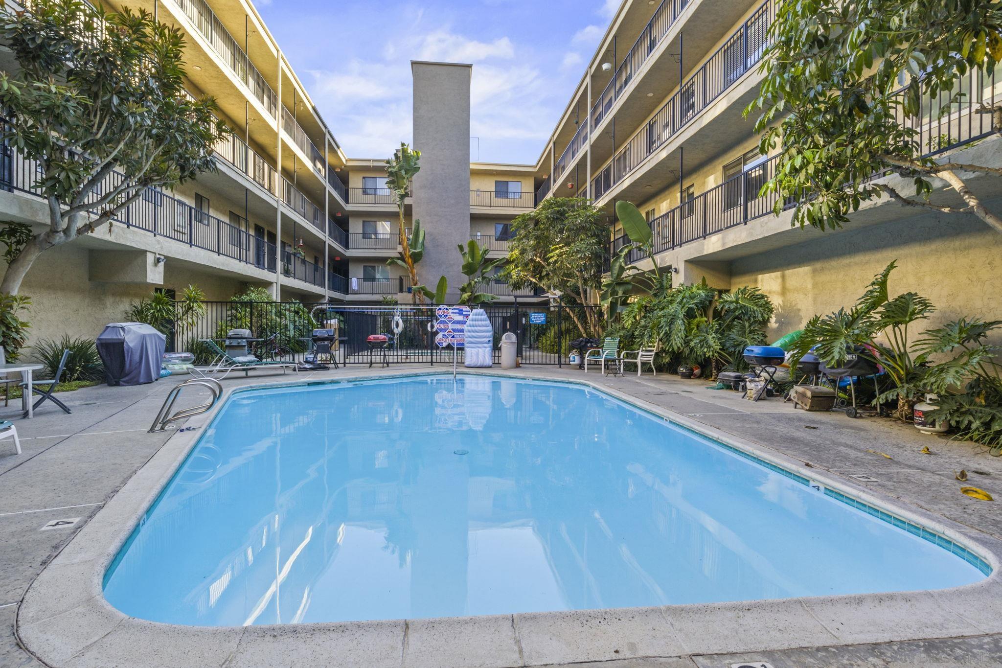 a view of a swimming pool with sitting area