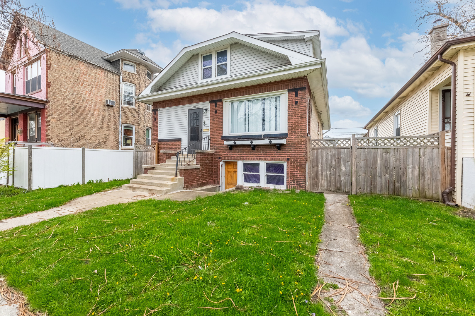 a view of a house with a yard and deck