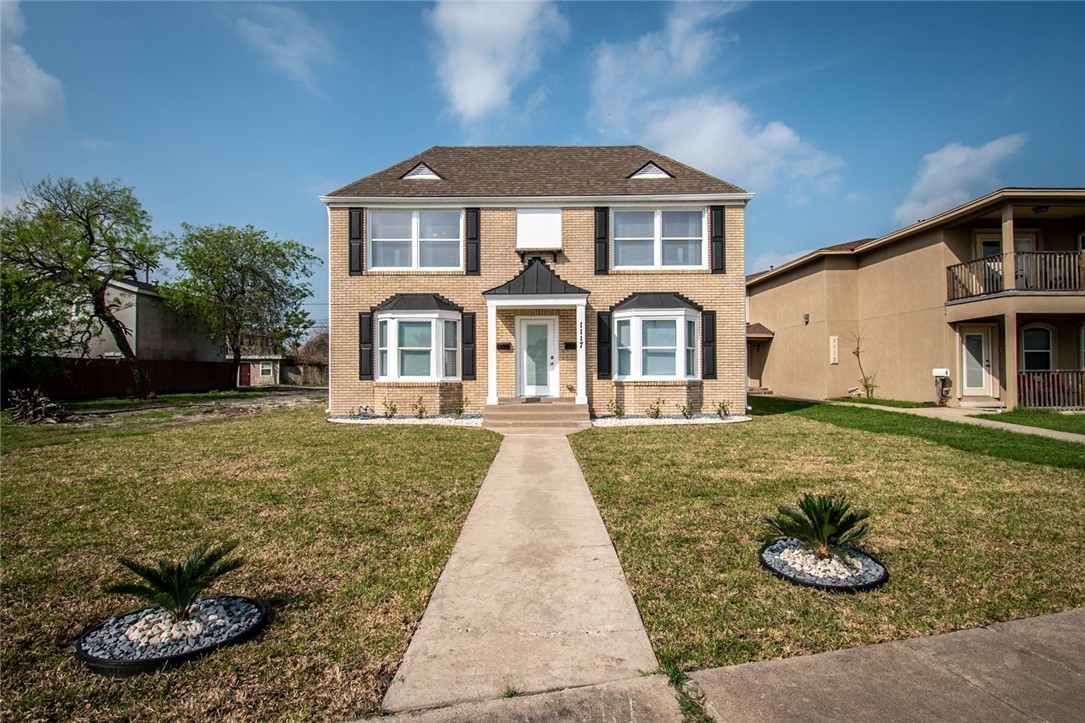 a front view of a house with entertaining space