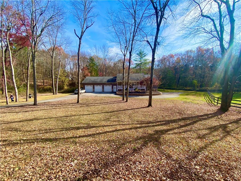 View of yard with a garage