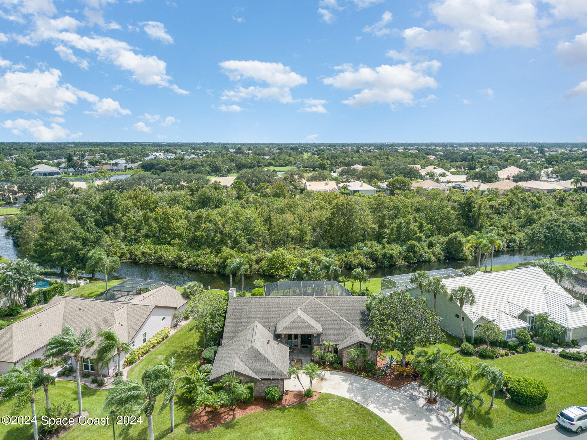 an aerial view of a houses with city view