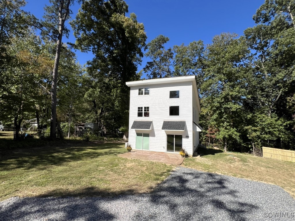 a view of house with trees in the background