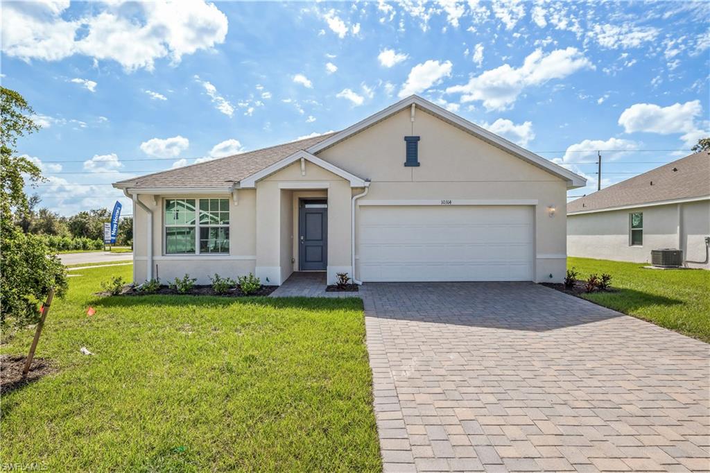 Single story home with a garage, a front lawn, and central air condition unit