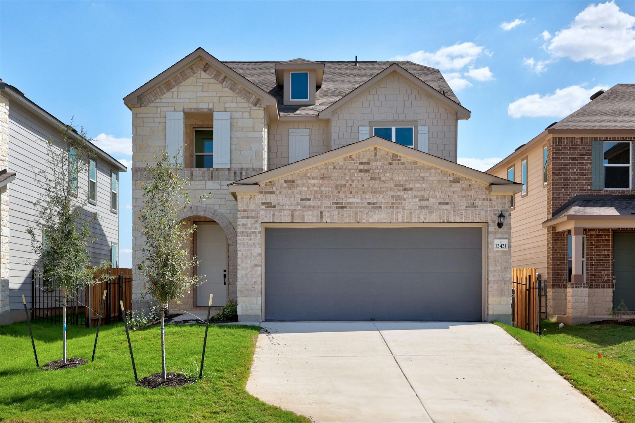 a front view of a house with a yard