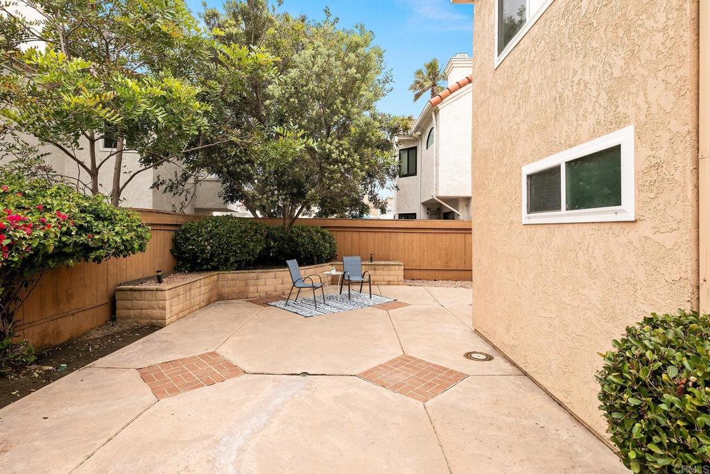 a view of a backyard with sitting area