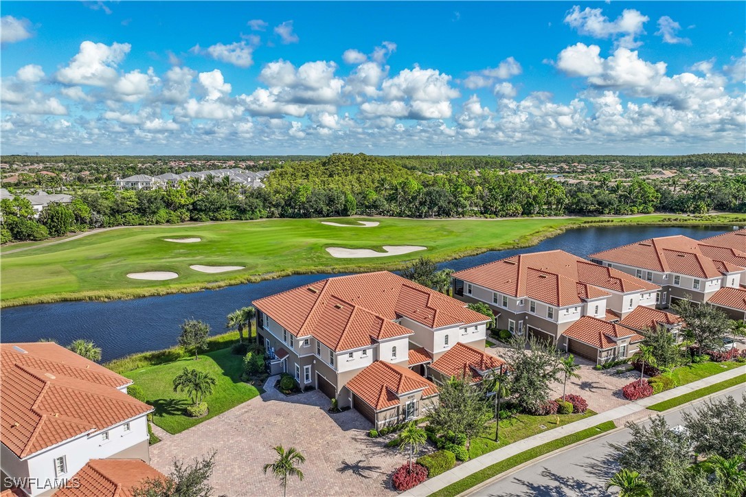 an aerial view of a house with big yard