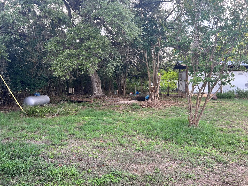 a view of outdoor space with deck and yard