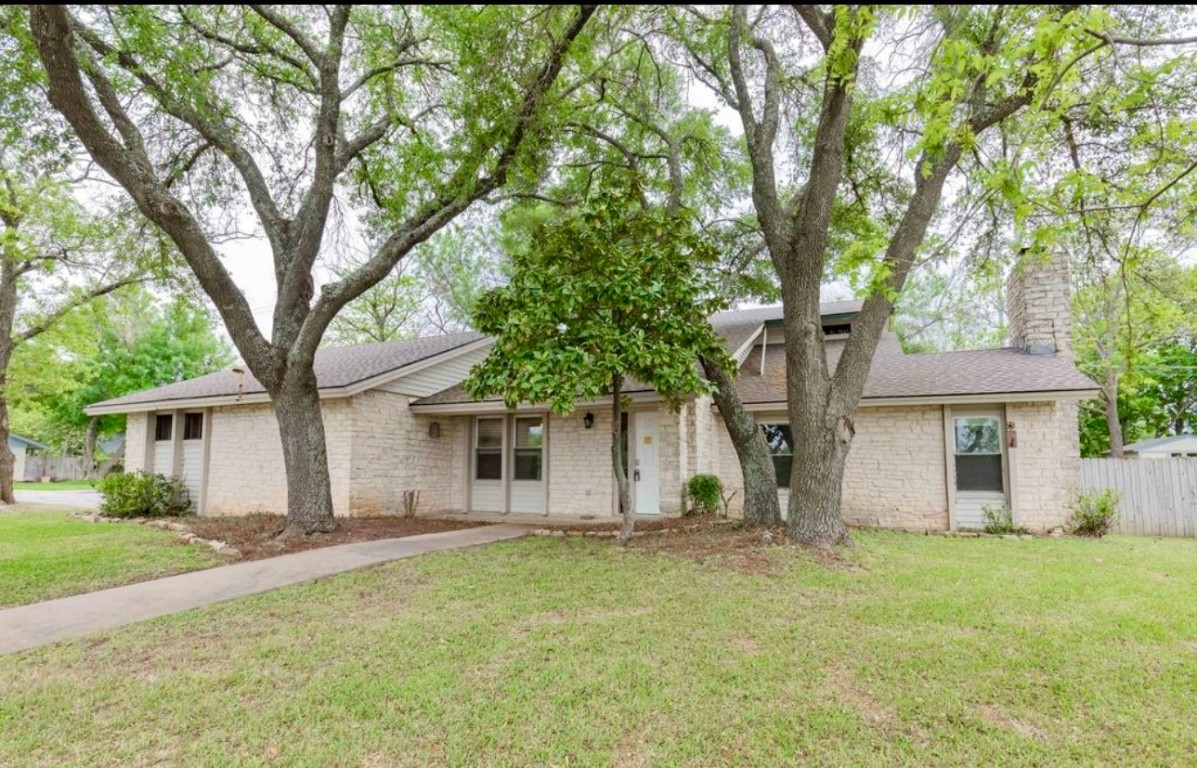 a house with trees in front of it