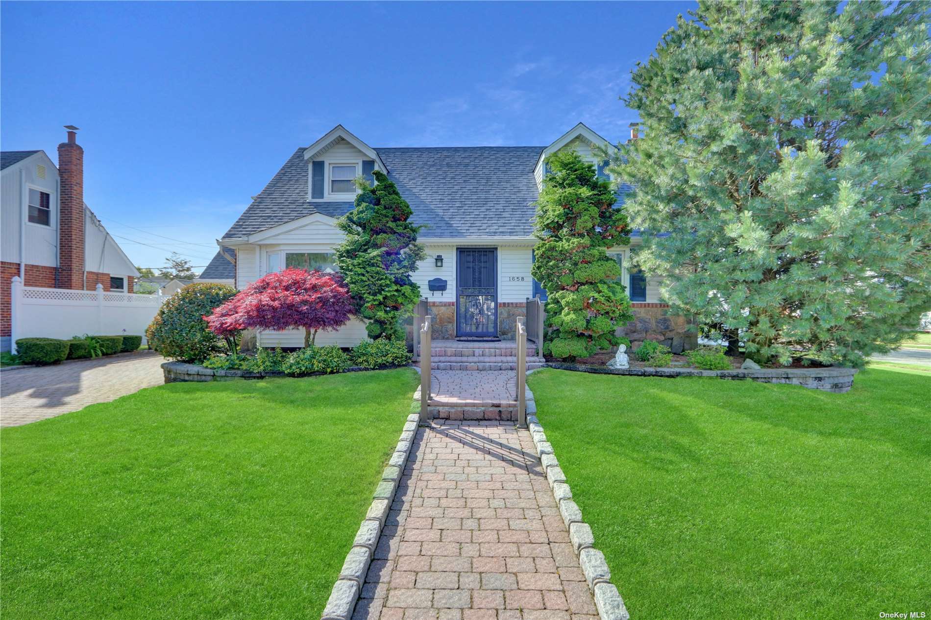 a front view of house with garden