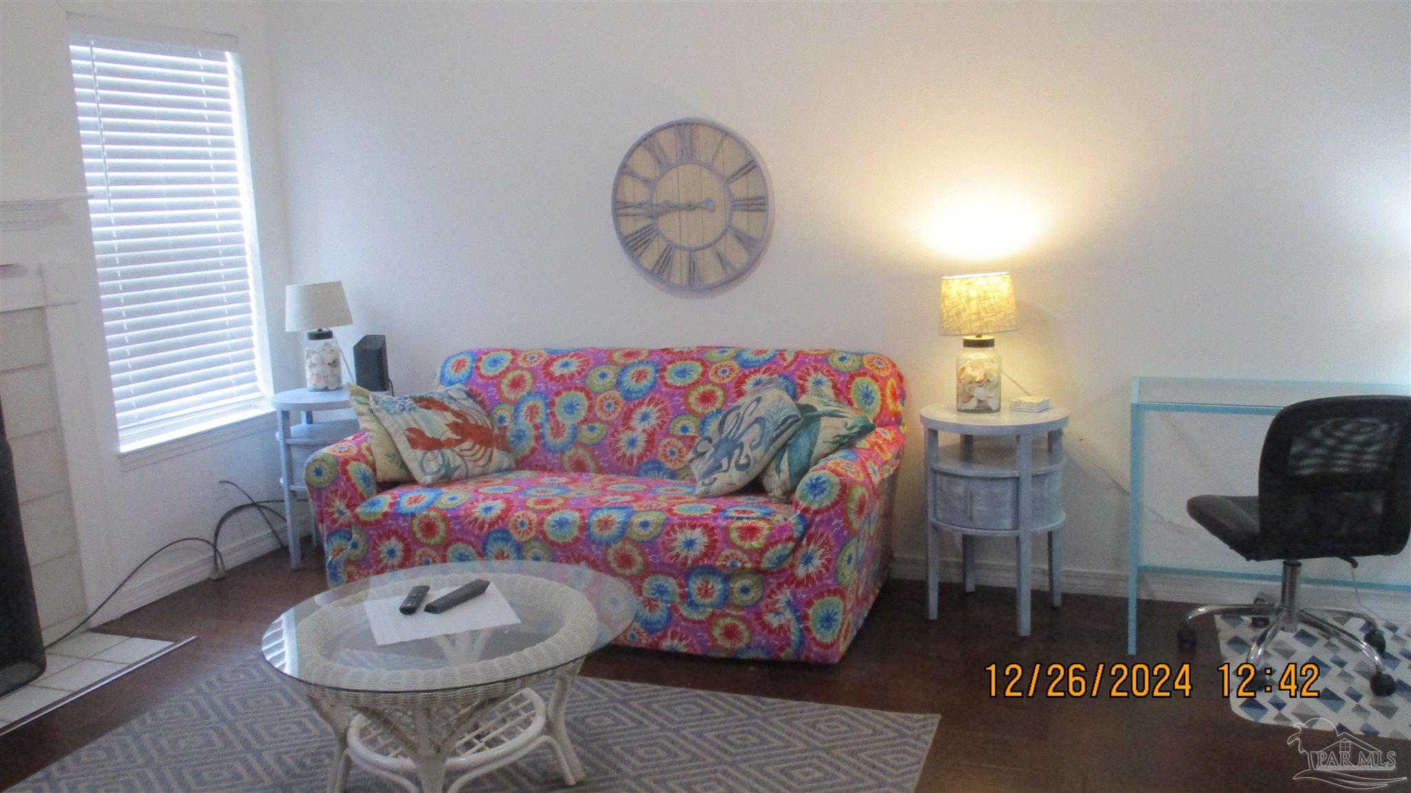 a living room with furniture and a window