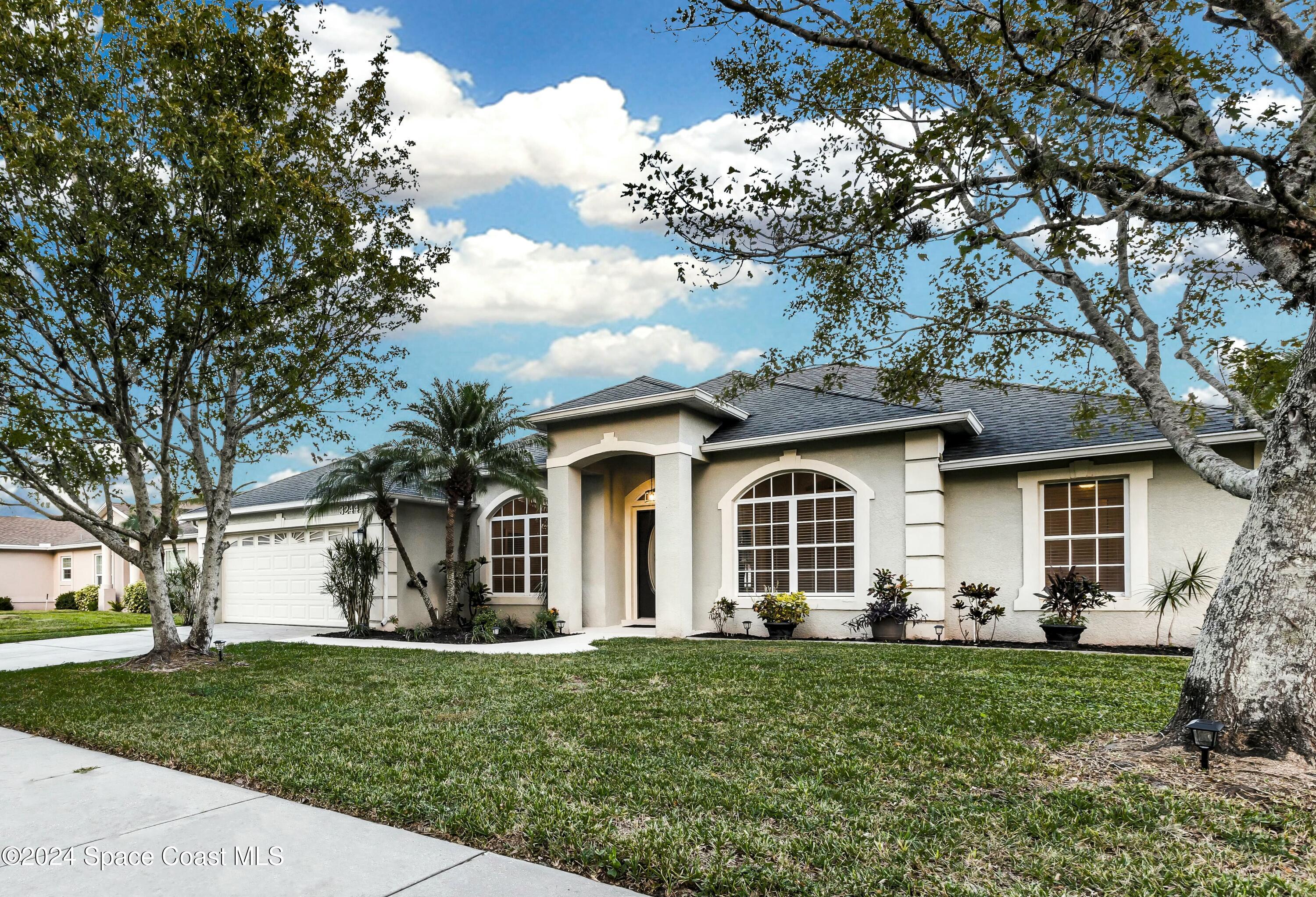 front view of a house with a yard