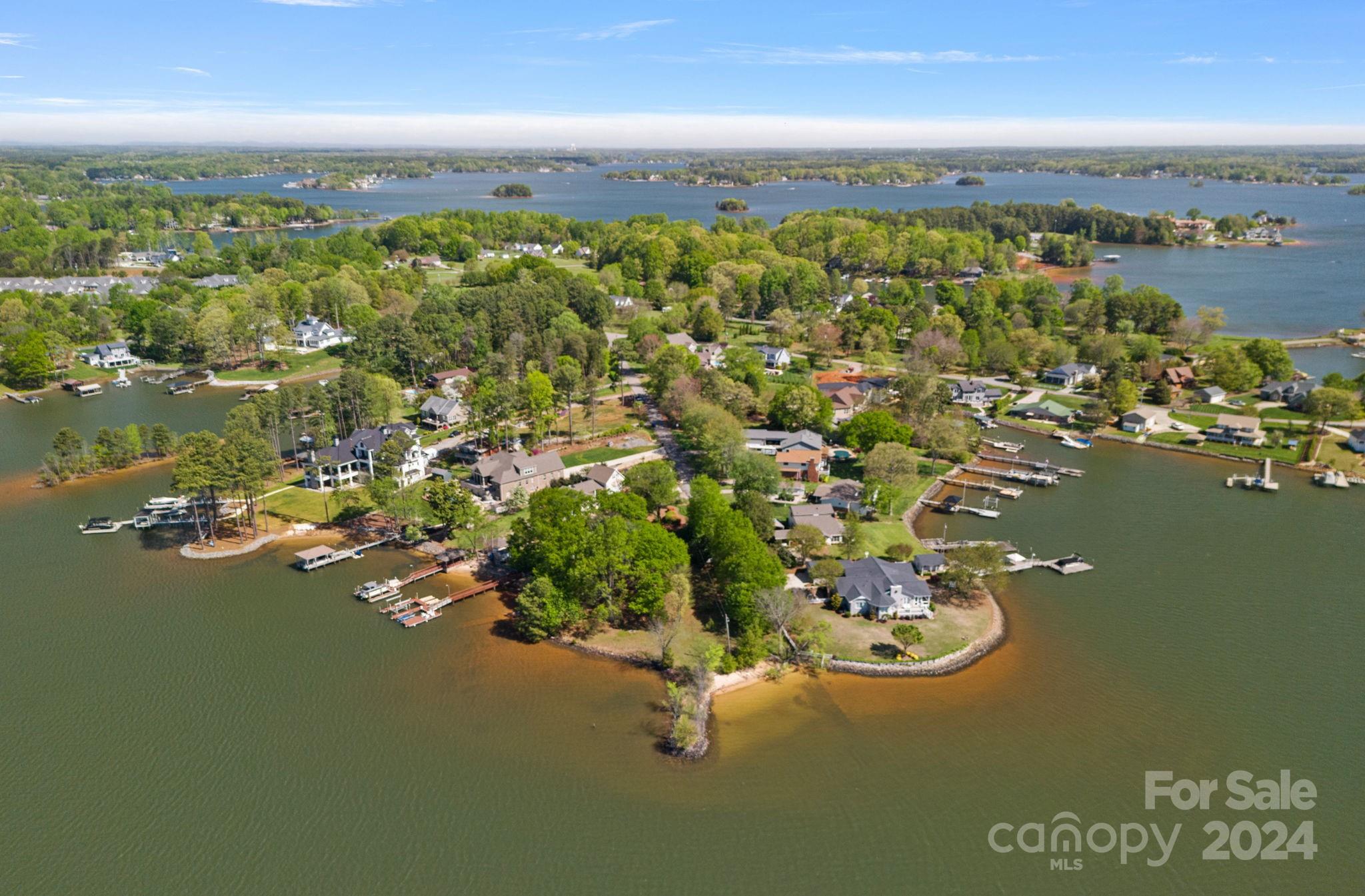 an aerial view of a houses with ocean view