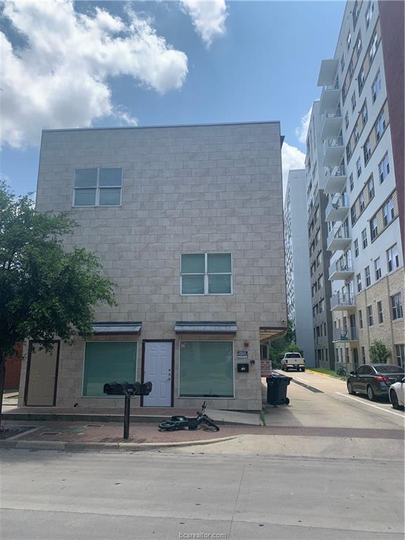 a view of a building with a street