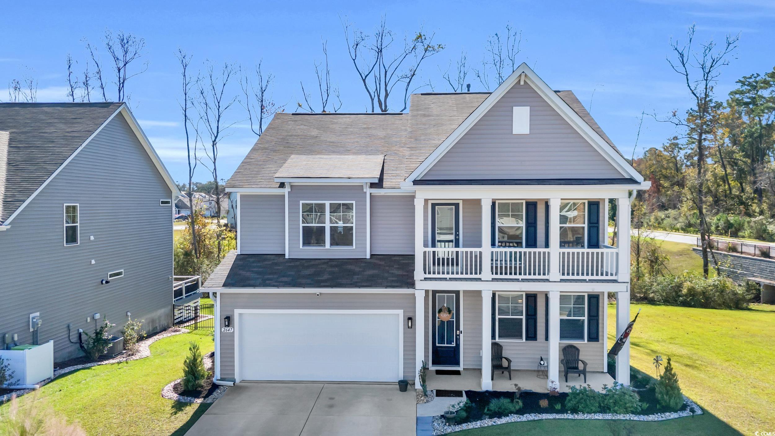 View of front facade with a porch, a garage, a fro