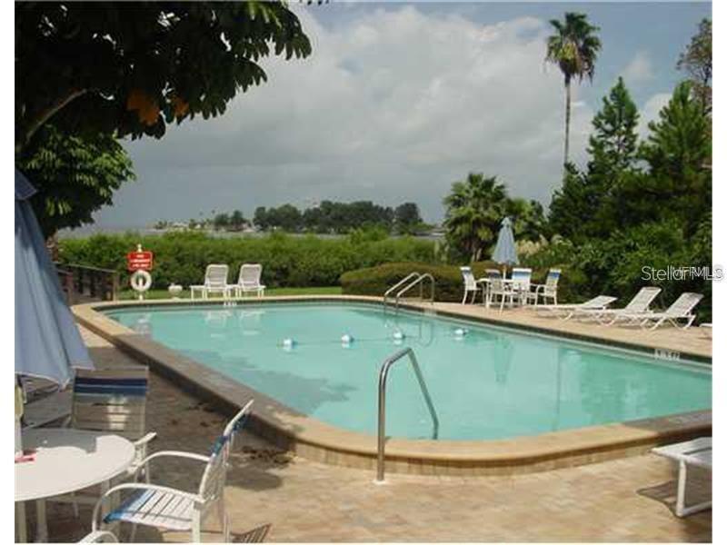 a view of a swimming pool with a terrace