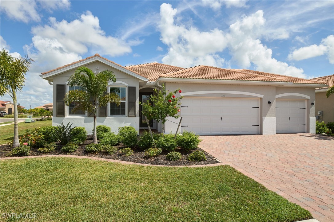 a front view of house with yard and green space