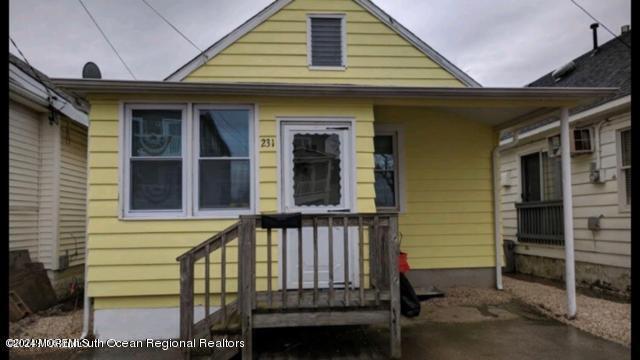 a front view of a house with a porch