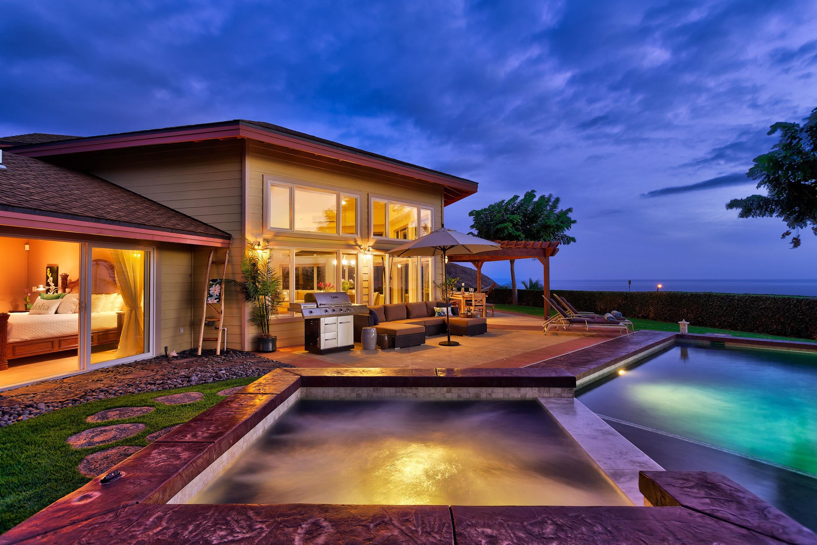 a view of a swimming pool with chairs in patio