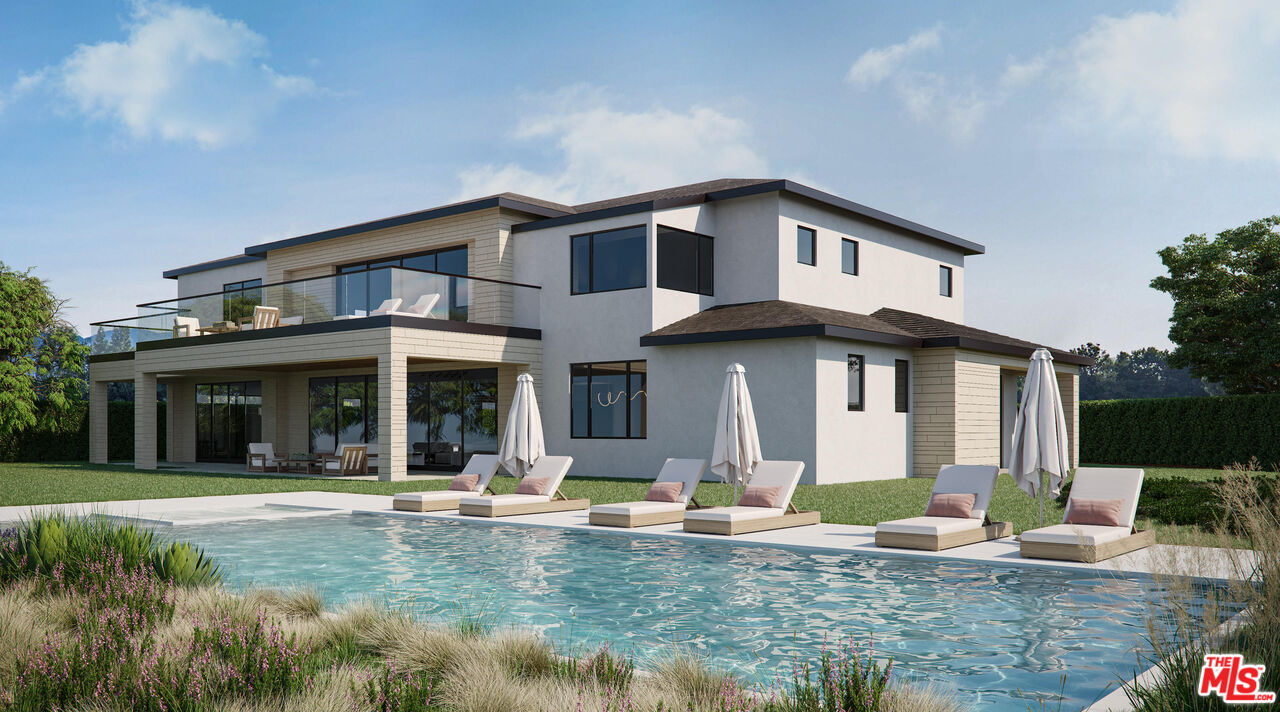 a front view of a house with swimming pool and porch