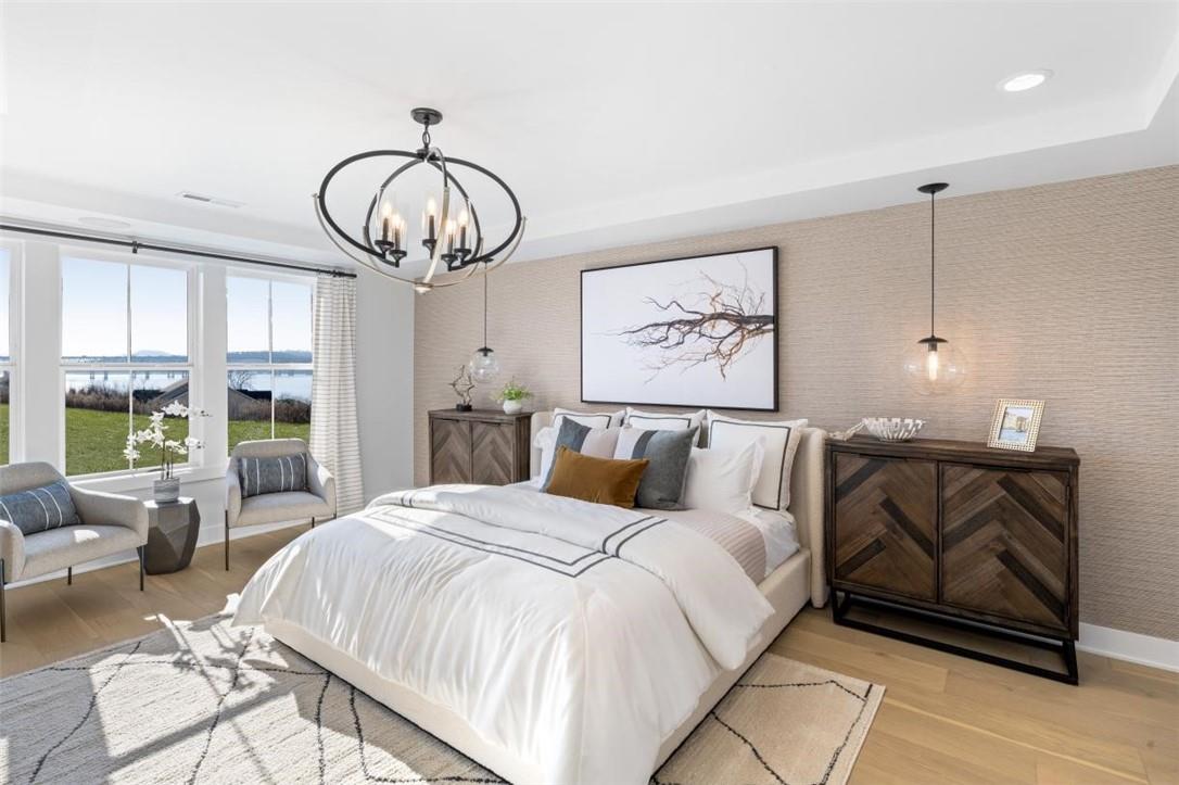 a bed room with a bed mirror and a large window