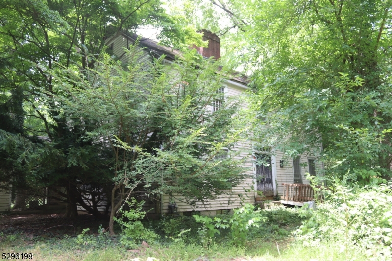 a view of a house with a tree