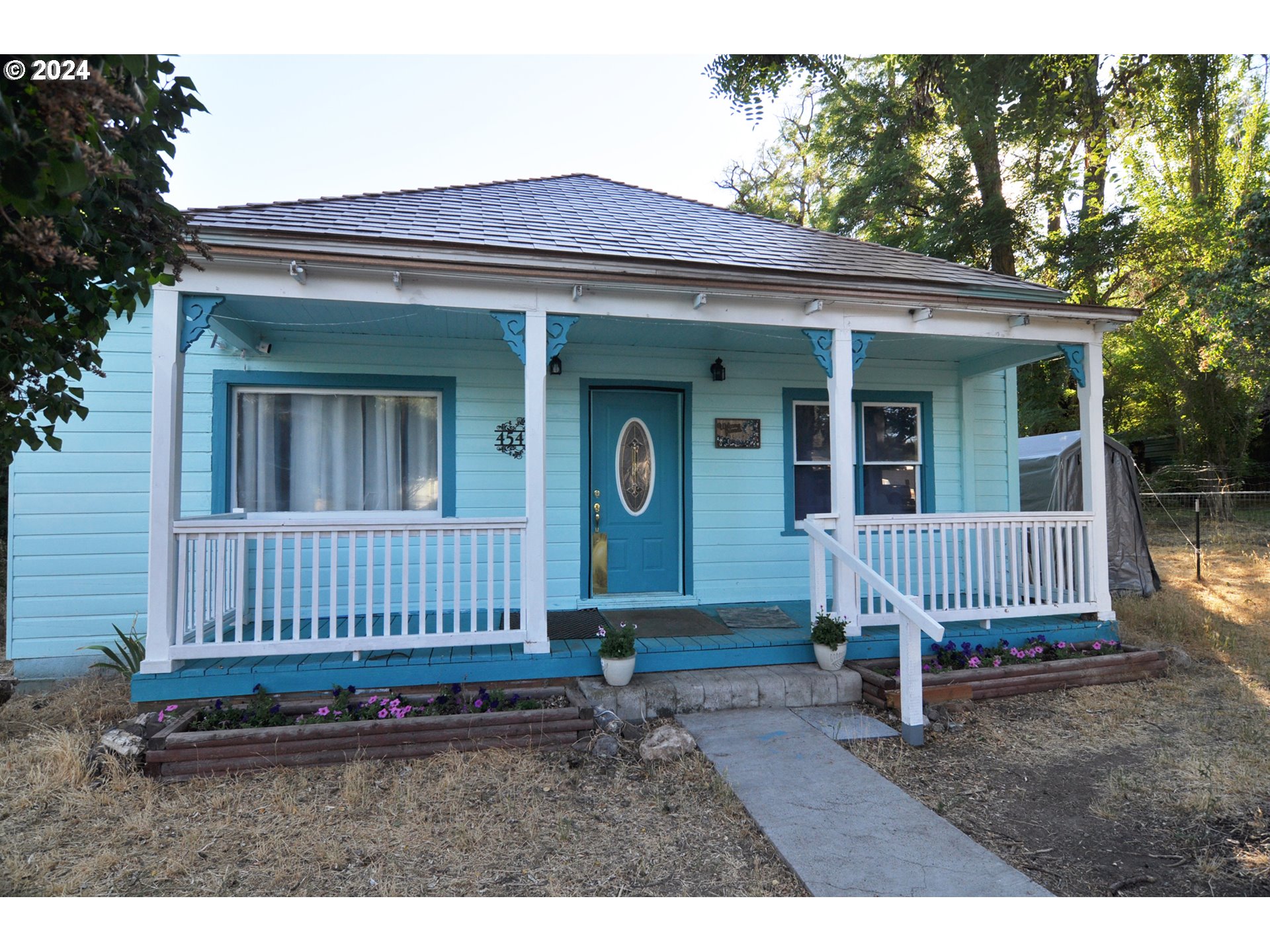 front view of a house with a yard