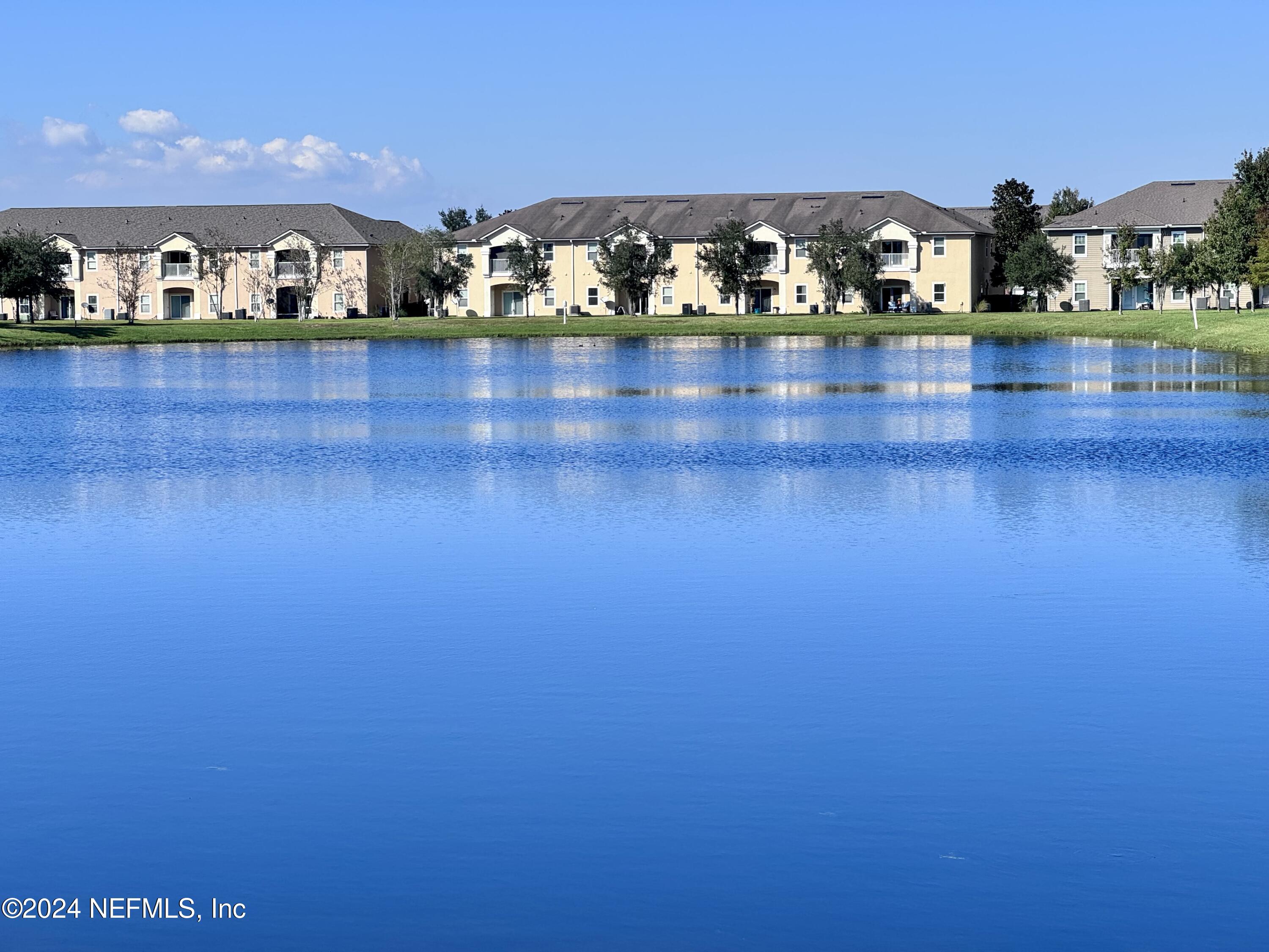 a view of a lake with an house