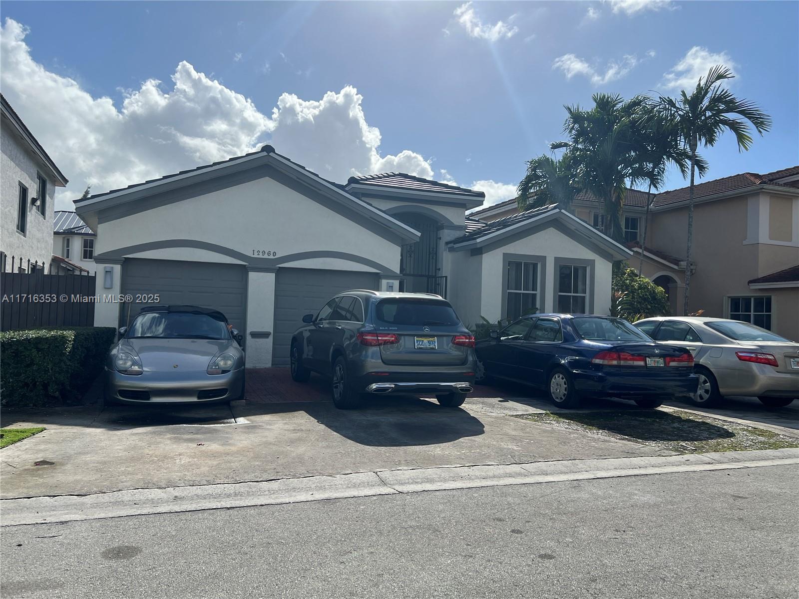 a car parked in front of a house