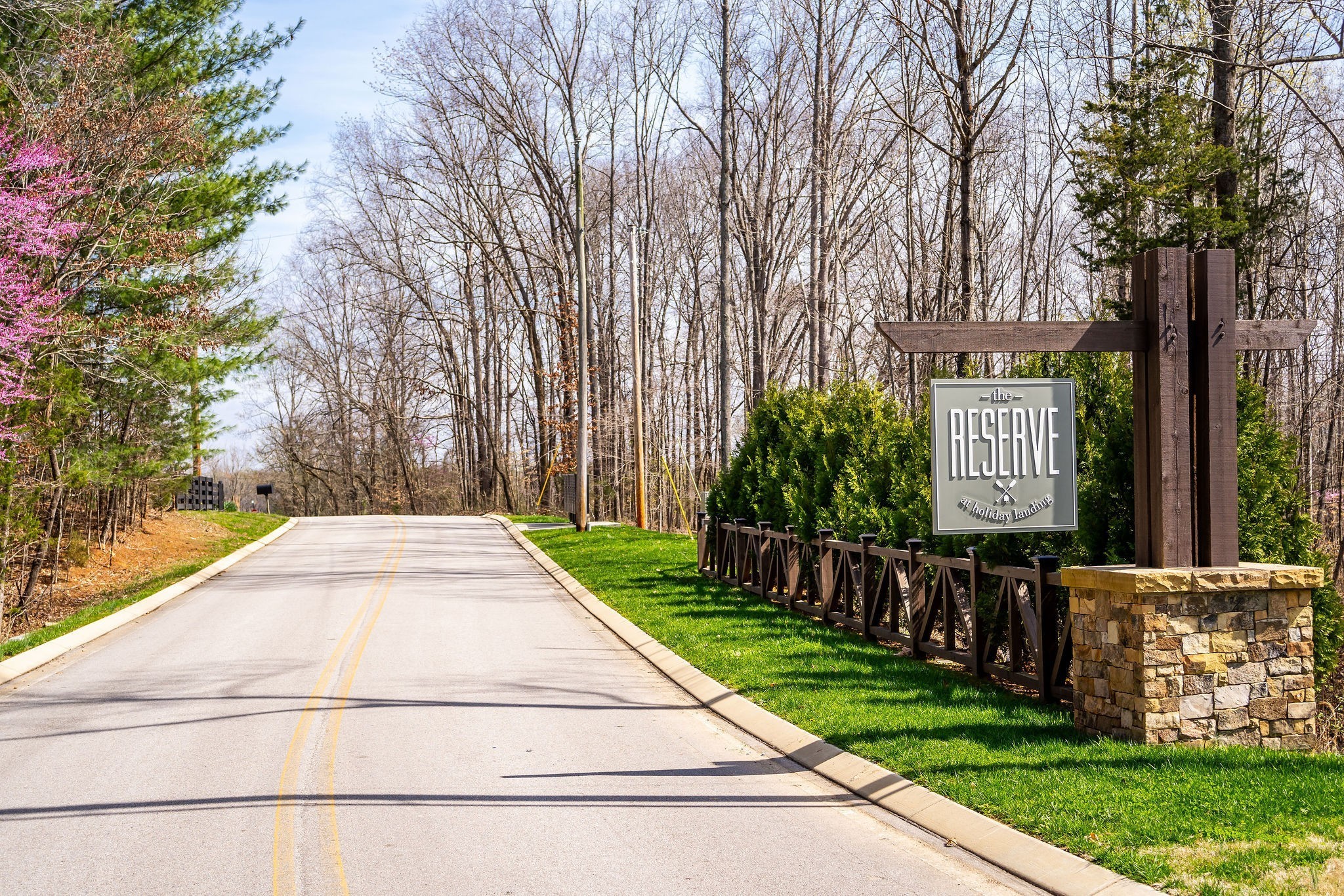 a sign board with yard in front of it