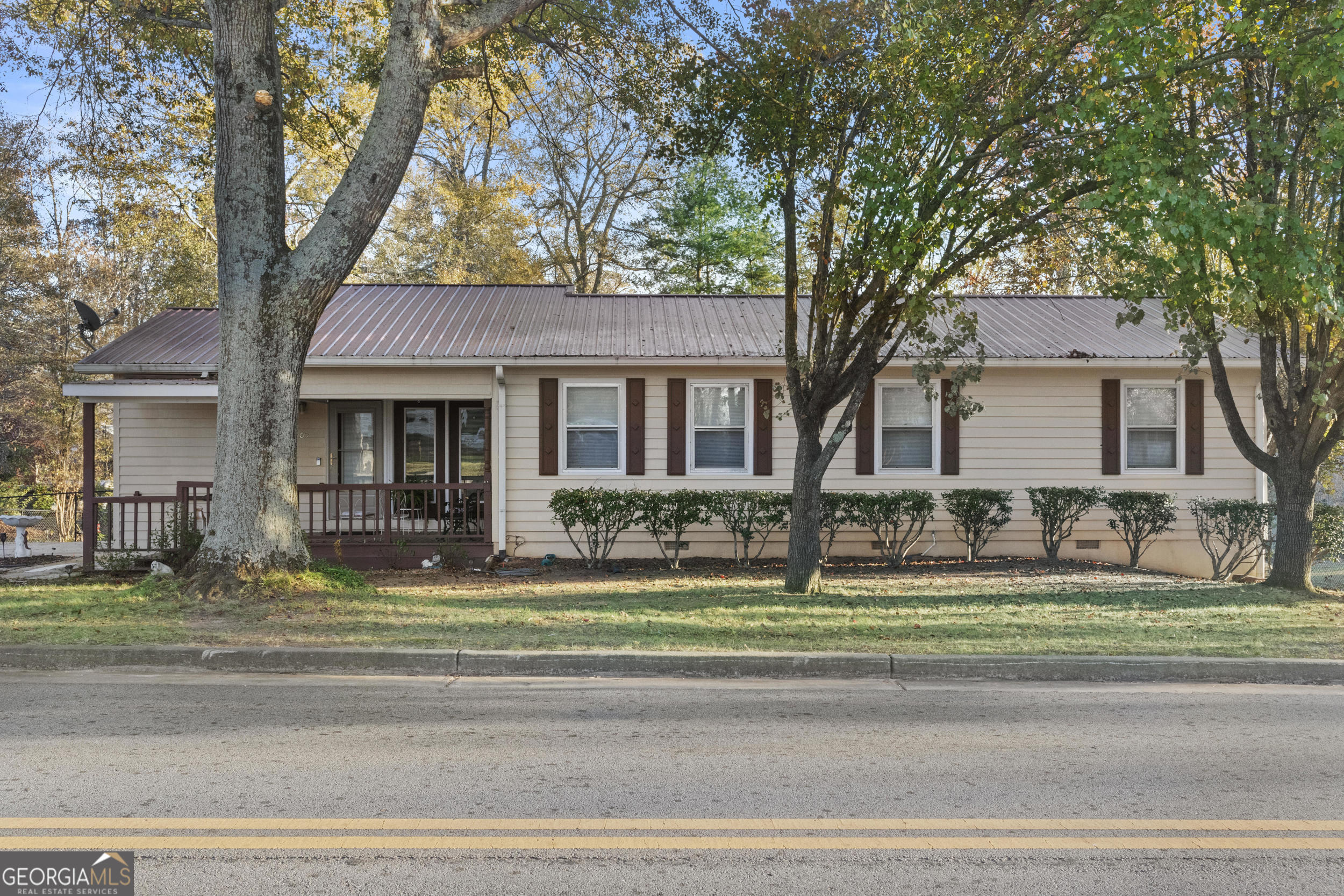 a front view of a house with a yard