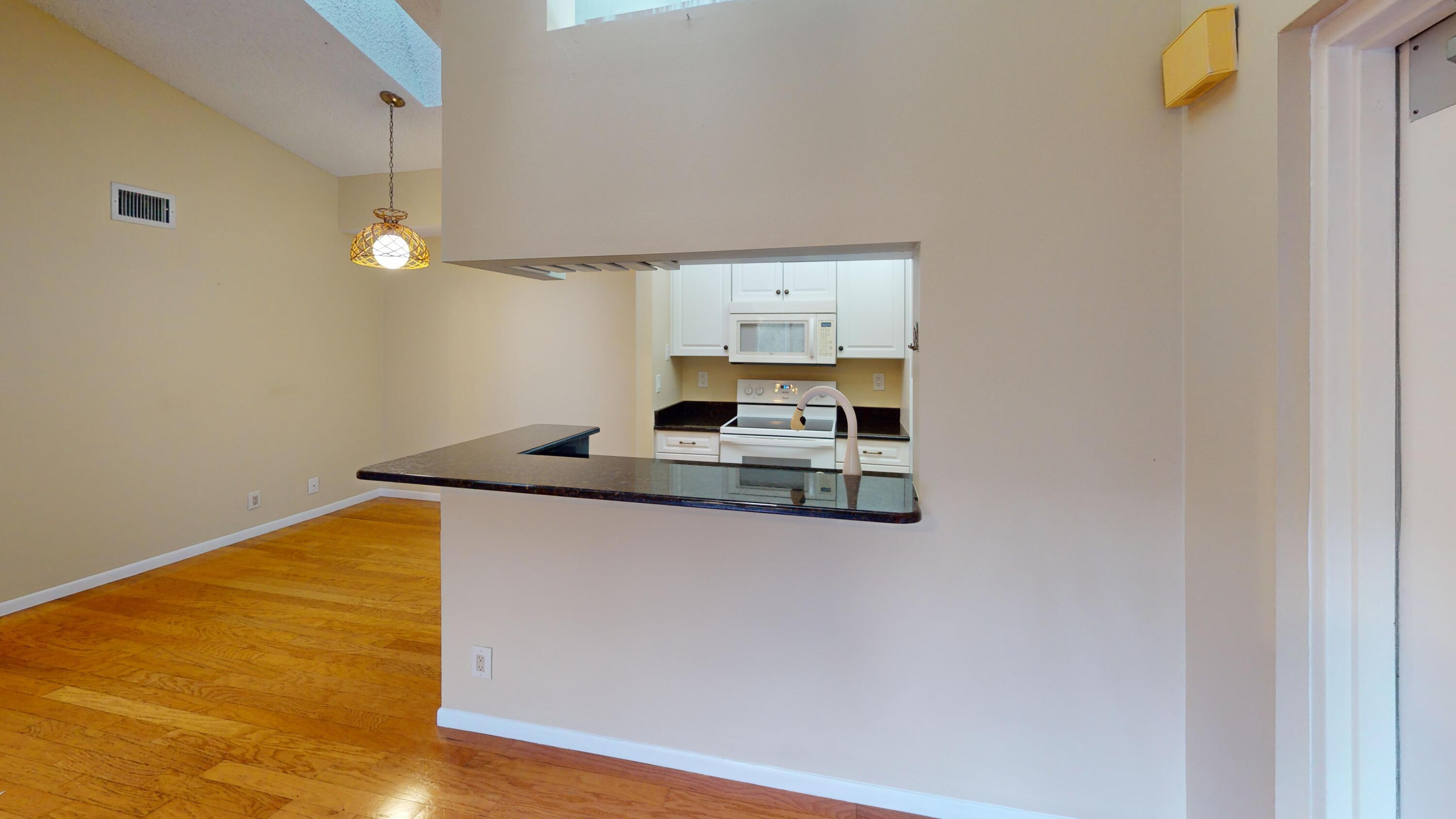 a kitchen with a sink and a refrigerator