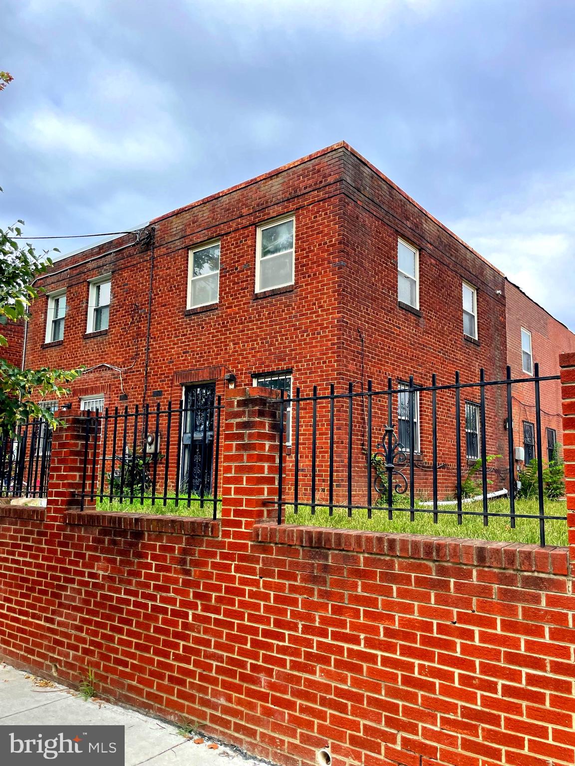 a front view of a house with large windows