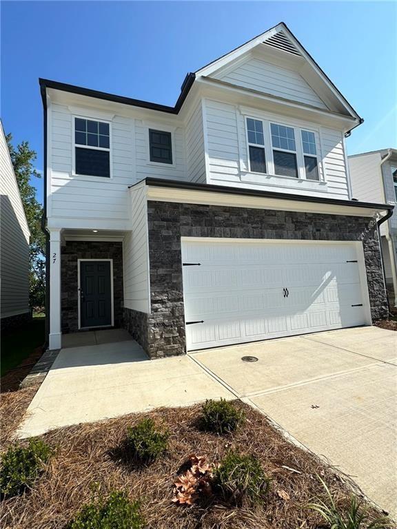 a front view of a house with a garage