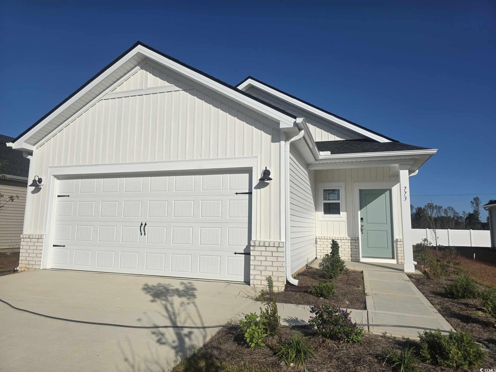 View of front of house with a garage