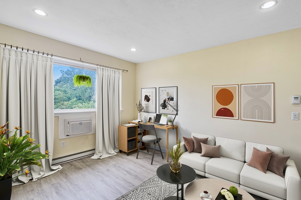 a living room with furniture and a window