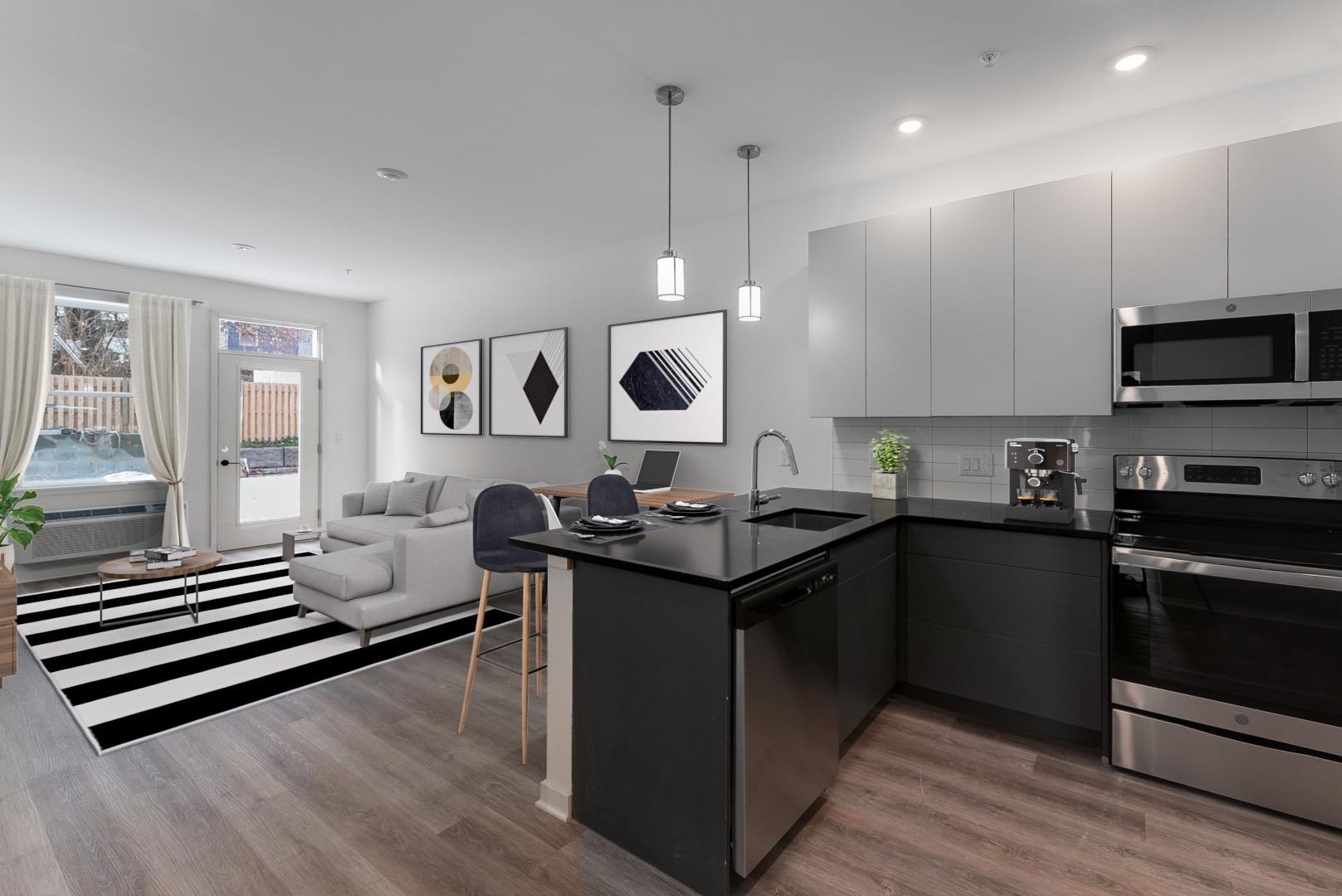 a kitchen with lots of counter space and appliances