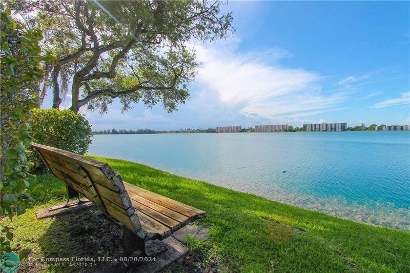 a view of a lake with a yard