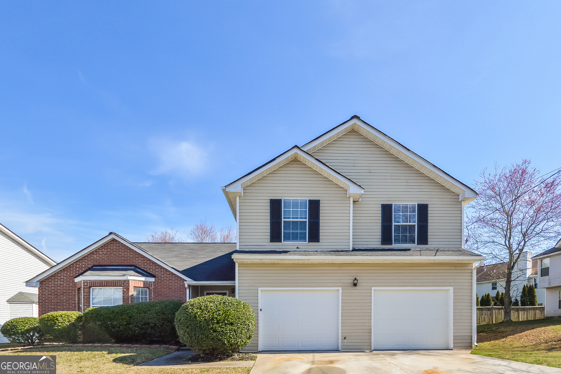 a front view of a house with garage