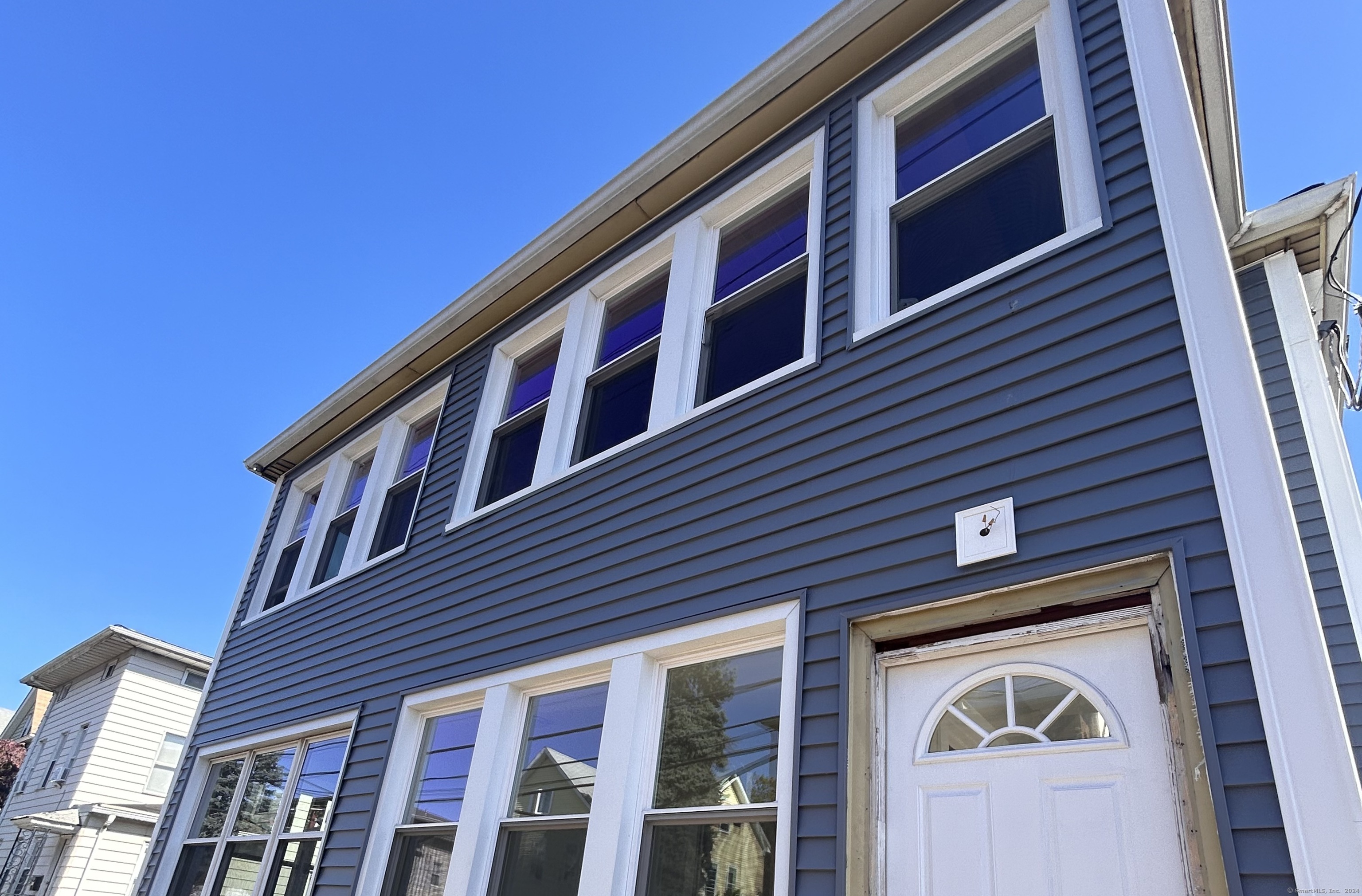 a front view of a house with a outdoor space