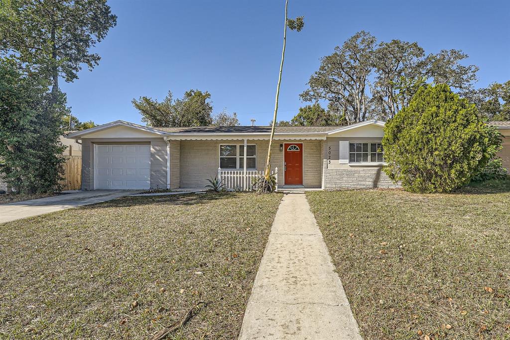 front view of a house with a yard